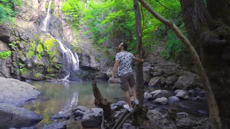 Man-Hiking-To-The-Waterfall.